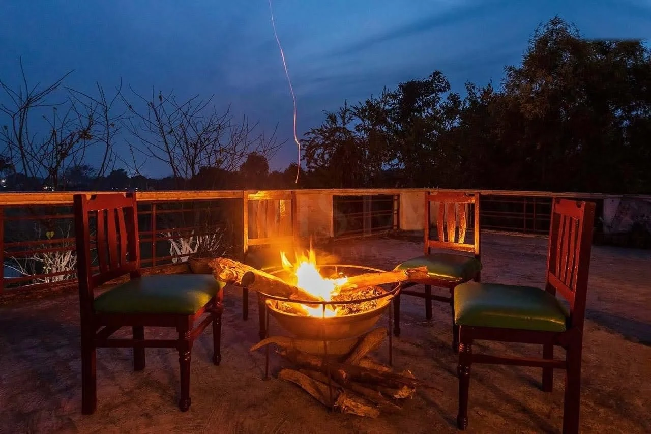 Twilight Open Hearth - Teak Armchairs Around the Crackling Firepit